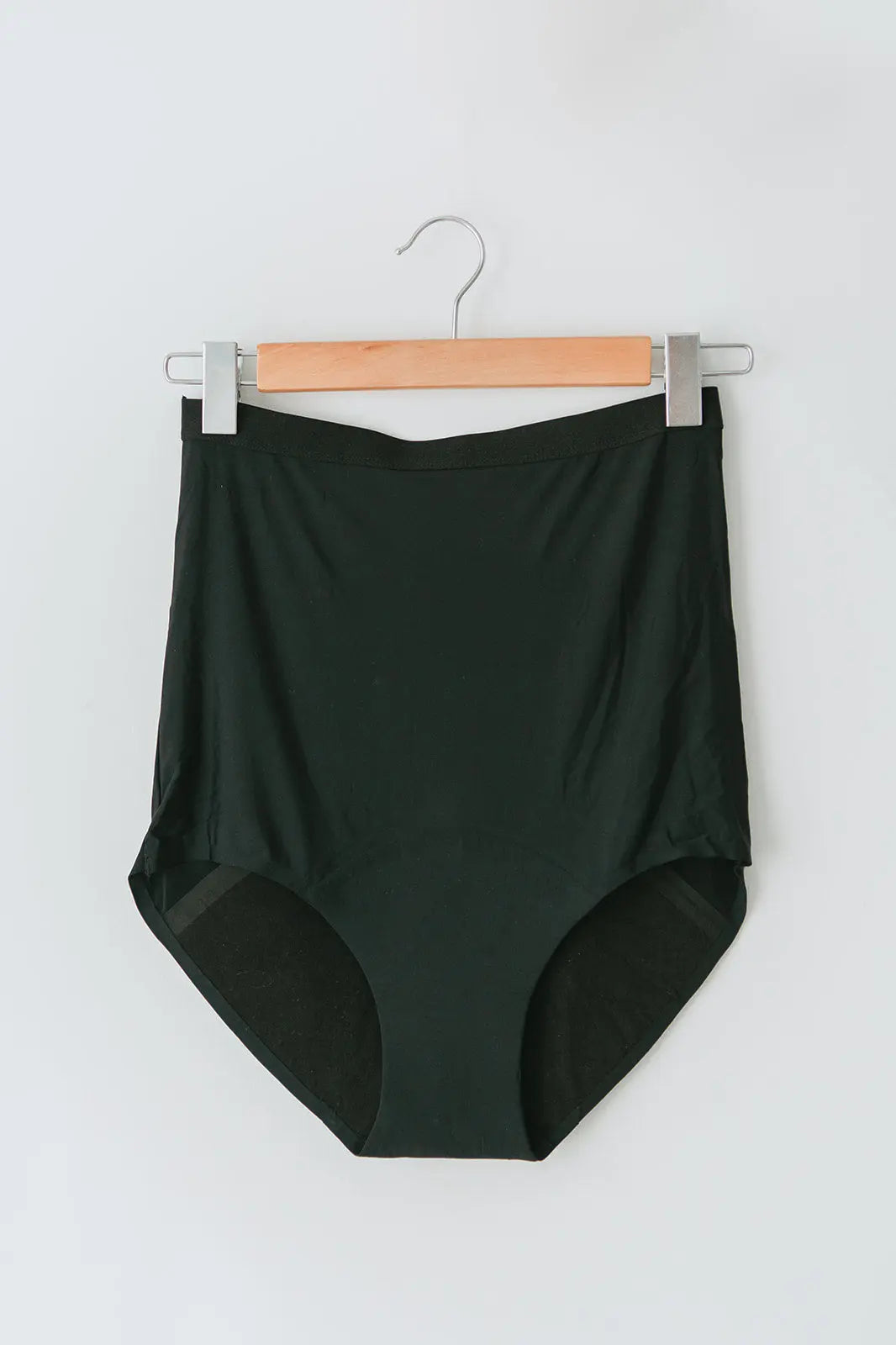 Front on image of Mummy Undies maternity underwear hanging on a coat hanger, showcasing soft, breathable fabric and full-coverage design for pregnancy and postpartum comfort.