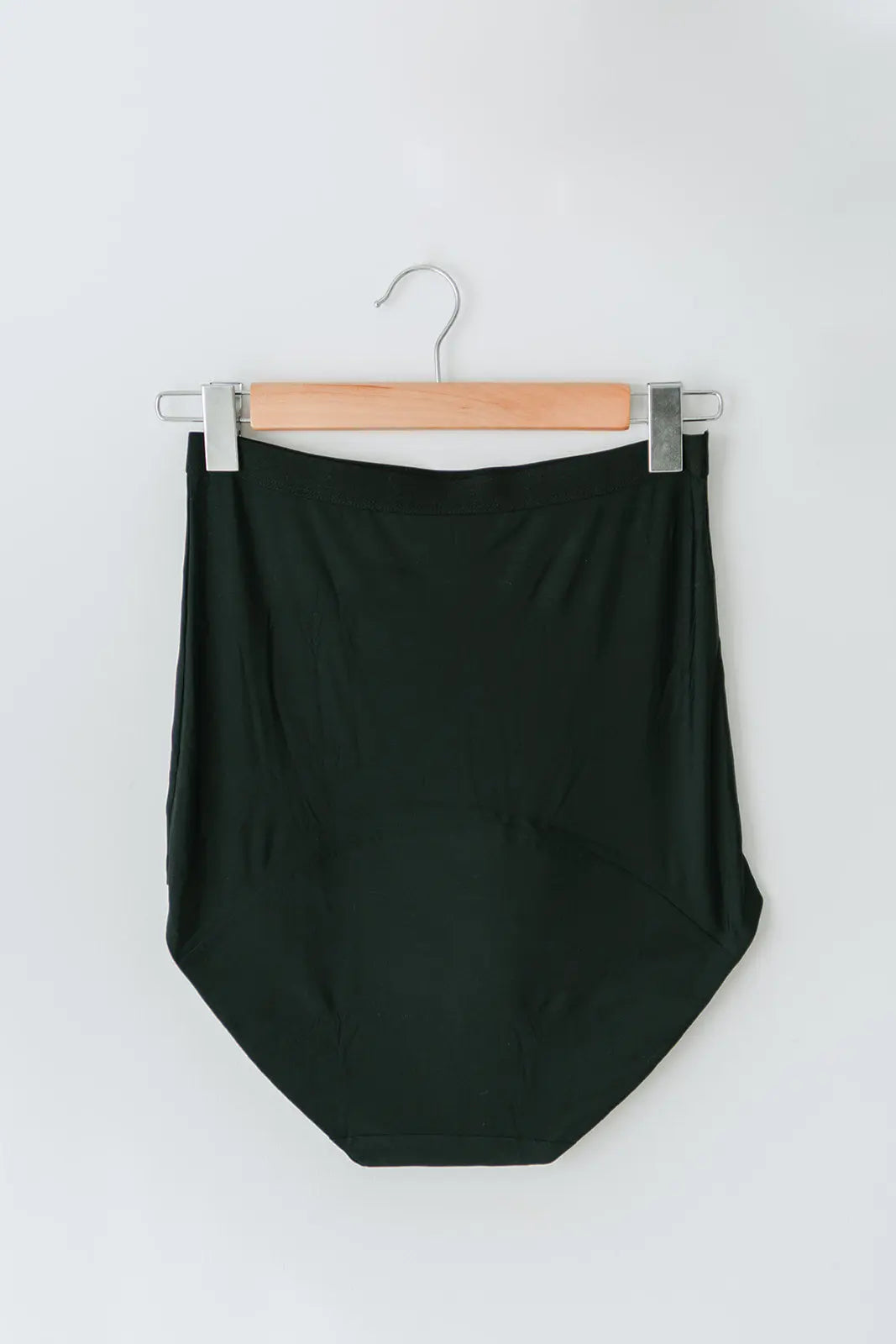 Back view of Mummy Undies maternity underwear hanging on a coat hanger, highlighting full-coverage design and supportive fit for pregnancy and postpartum.